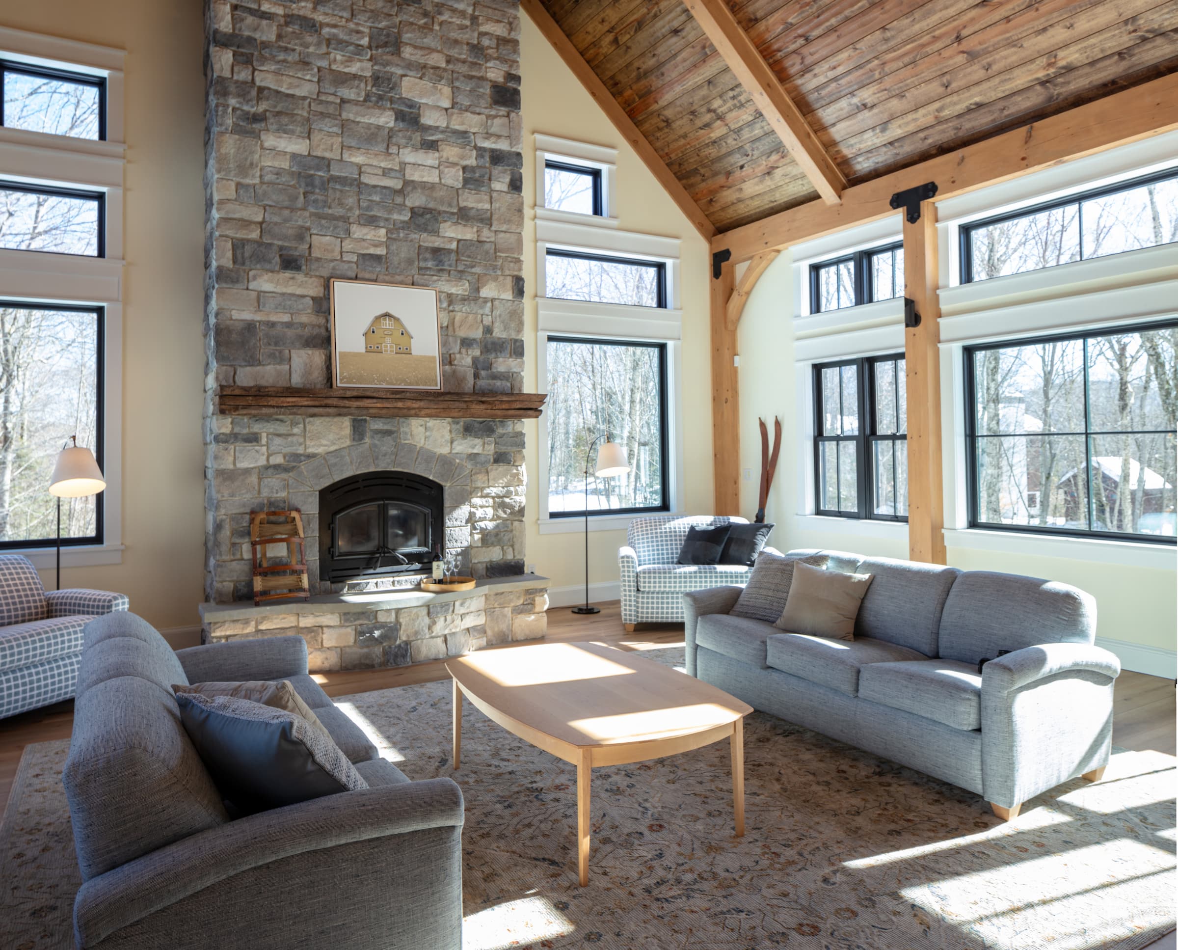 airy, comfy, skihouse living room with huge fireplace and soaring ceiling